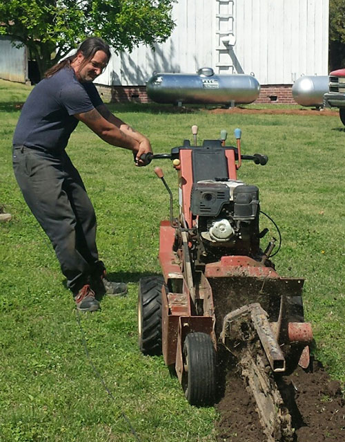 man operating digging equipment