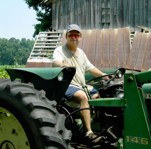 man on garden tractor